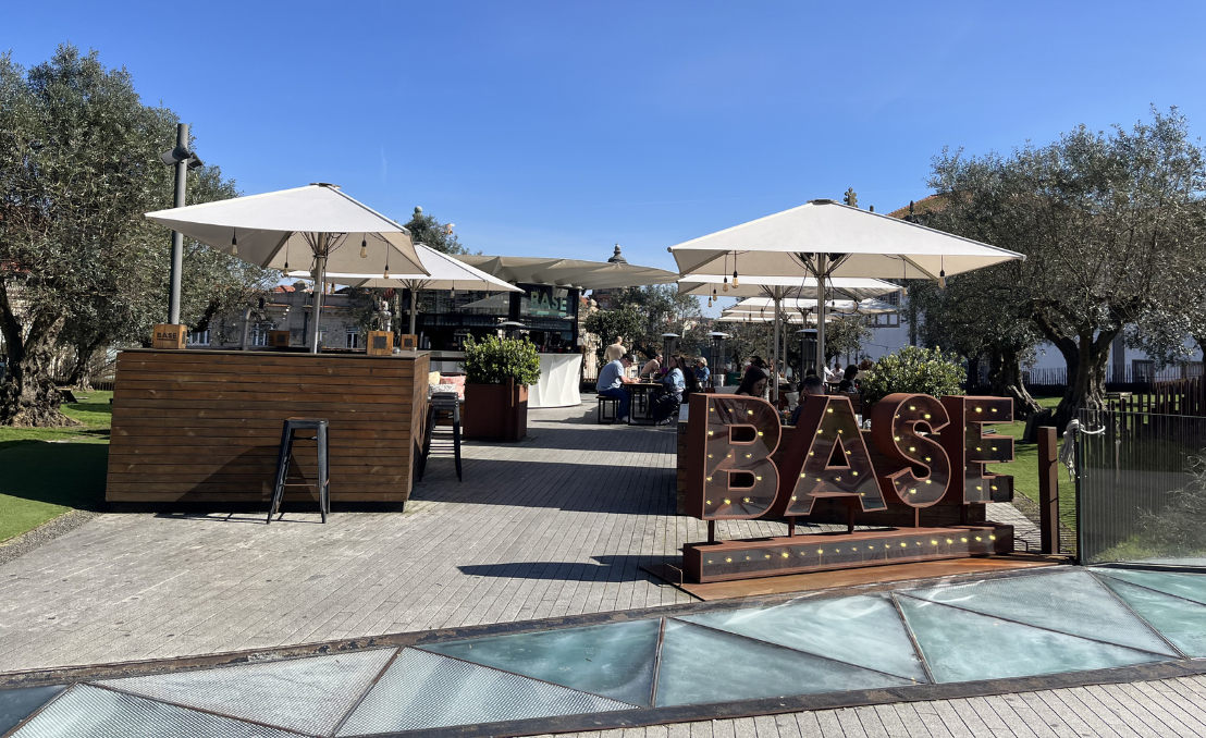Outdoor terrace with seating and umbrellas in Porto city center