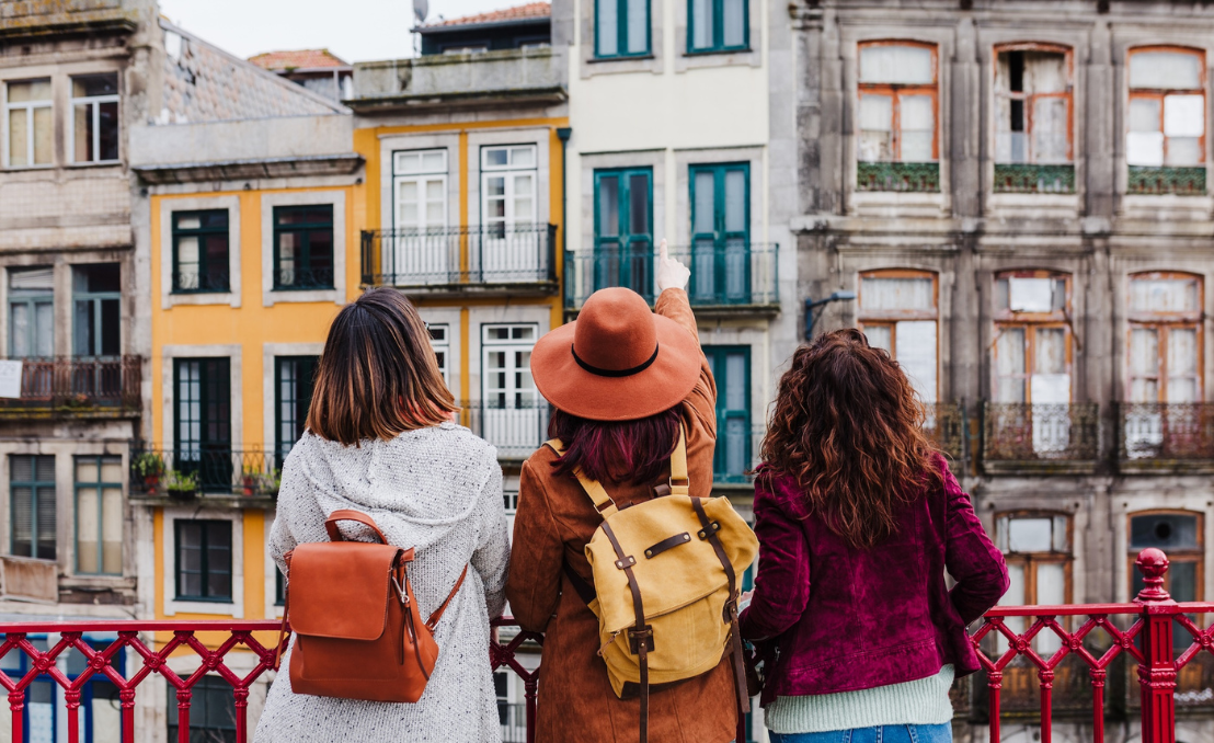 Three tourists exploring Porto’s historic city centre on foot